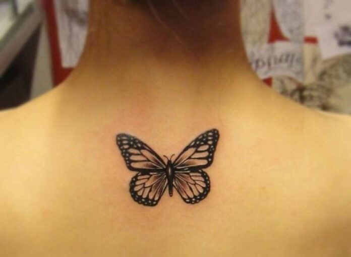 Grey-And-Black-Butterfly-Tattoo-On-Girl-Upper-Back