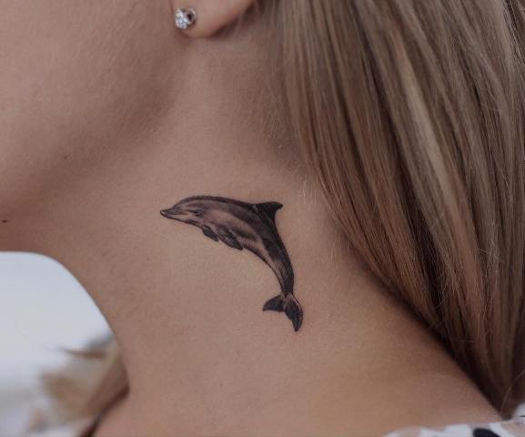 Small-dolphin-tattoo-idea-on-the-neck