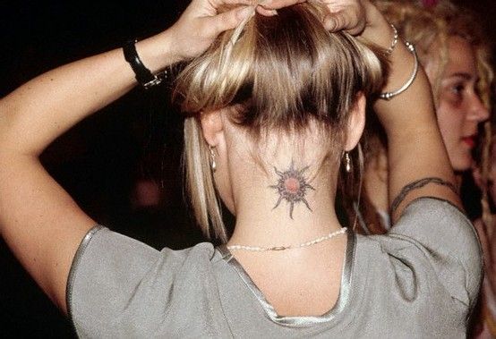 Sun tattoo on neck