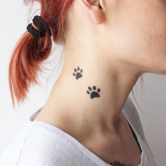 paw tattoo on neck